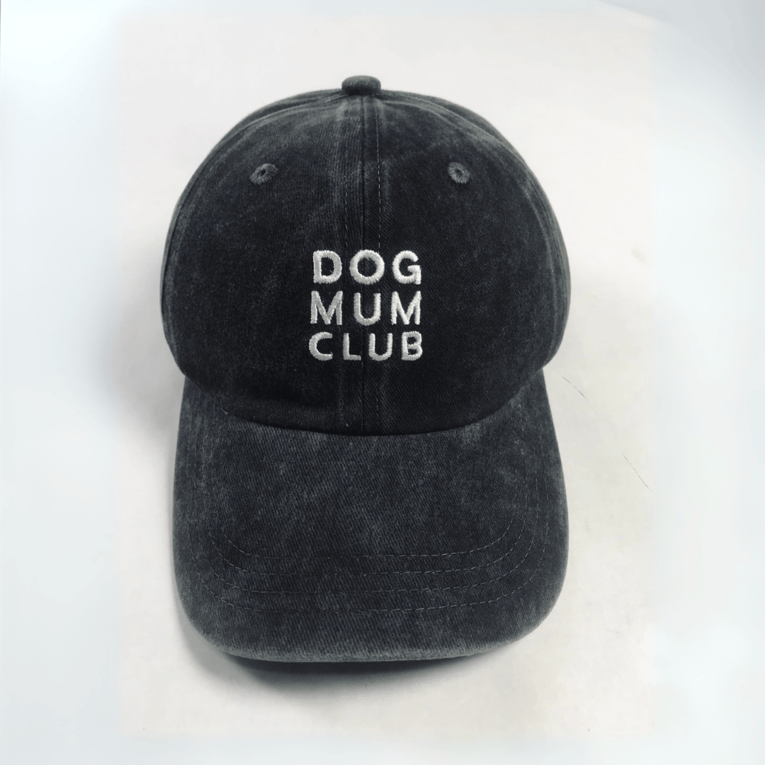 Black cap with 'DOG MUM CLUB' text on a white background