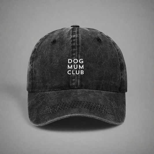 Black distressed cap with 'DOG MUM CLUB' text on a gray background