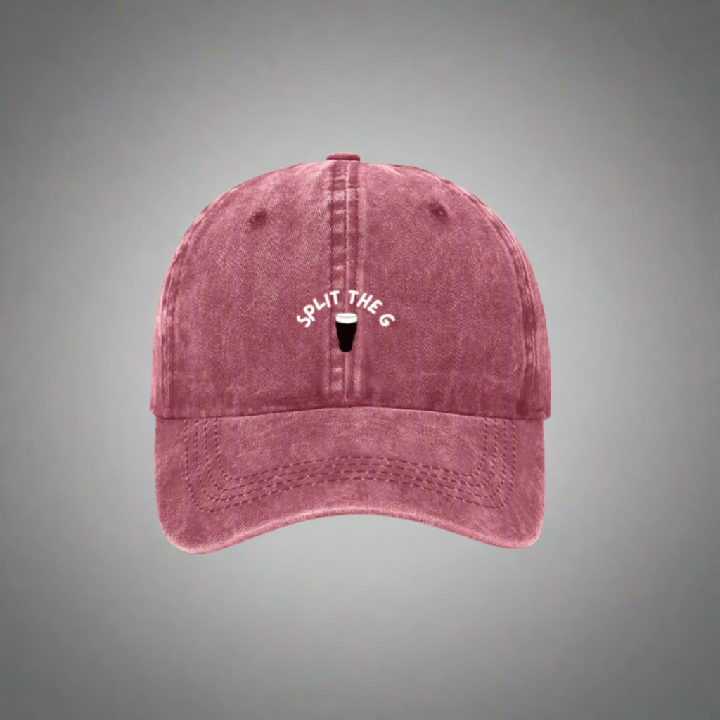 A red denim cap with 'SPLIT THE G' embroidered on the front.