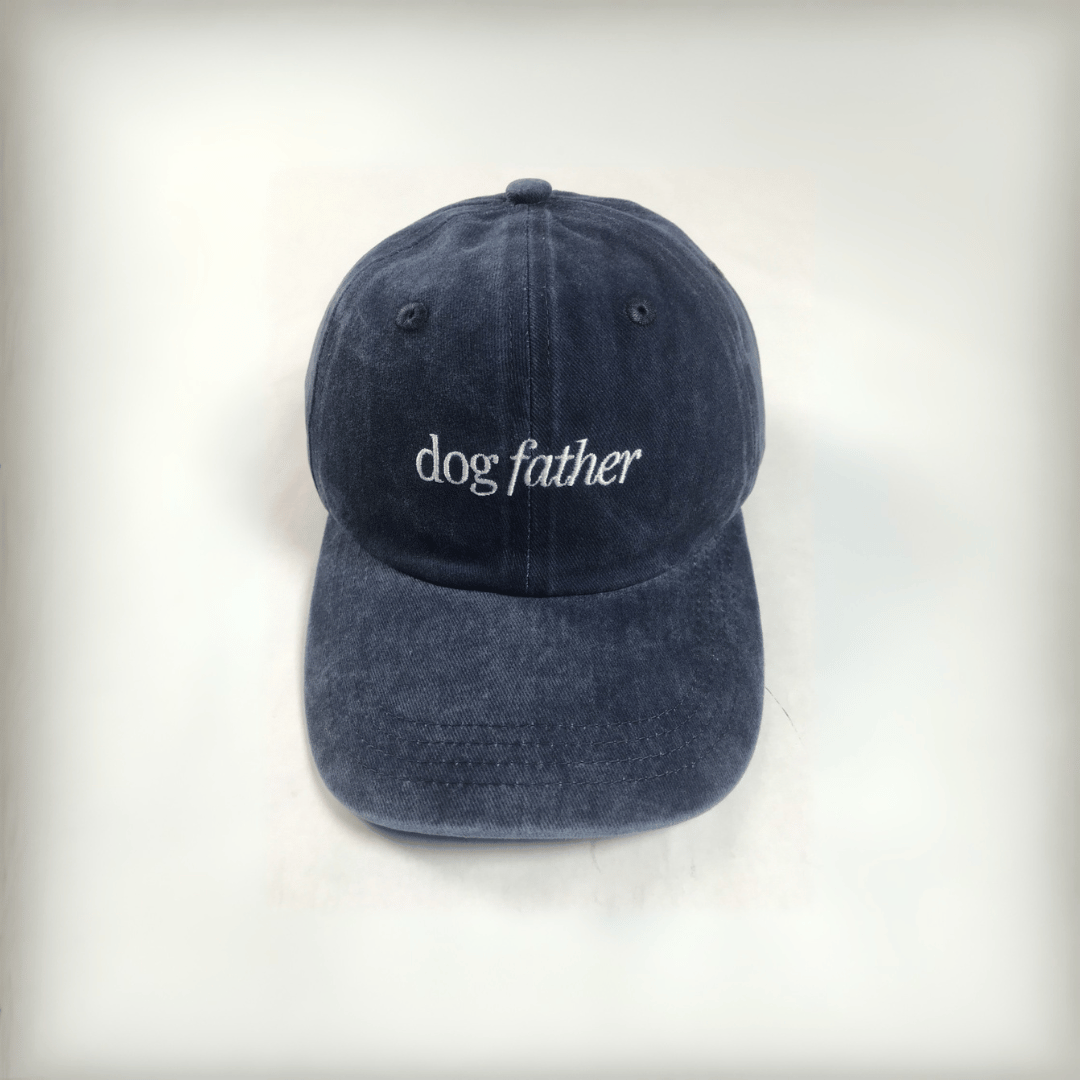 navy cap with white embroidered text that says "dog father