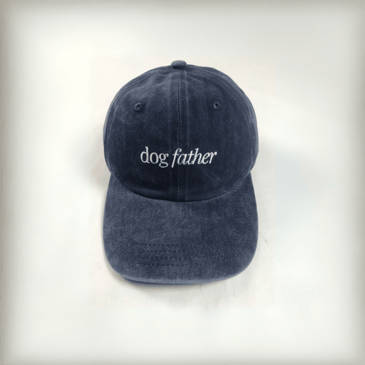 navy cap with white embroidered text that says "dog father