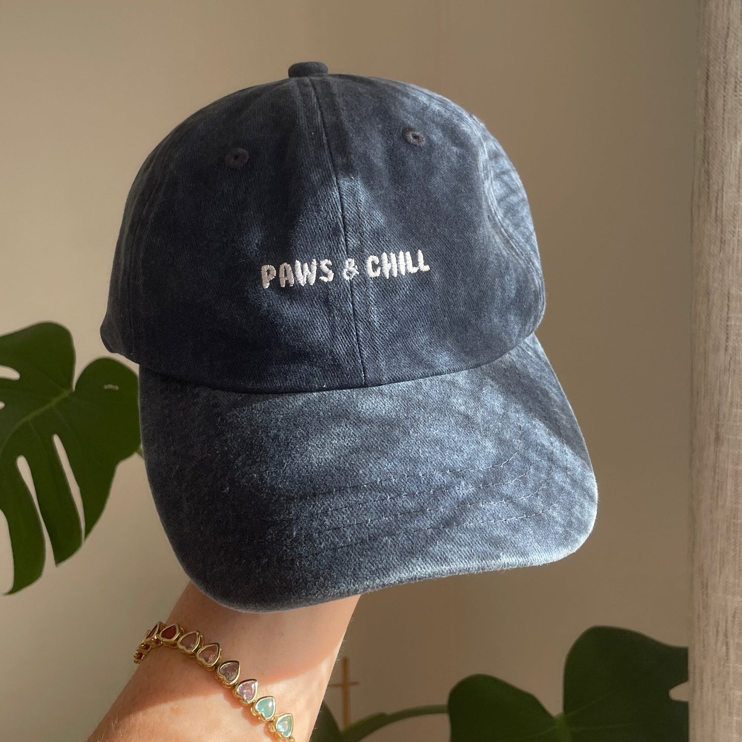 embroidered cap for dog owners. This navy cap says 'paws and chill' perfect gift idea for pet lovers