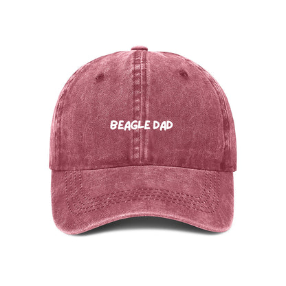 red denim baseball cap with 'BEAGLE DAD' text embroidered on the front.