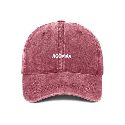 Maroon denim baseball cap with the word 'HOOMAN' embroidered in white on the front.