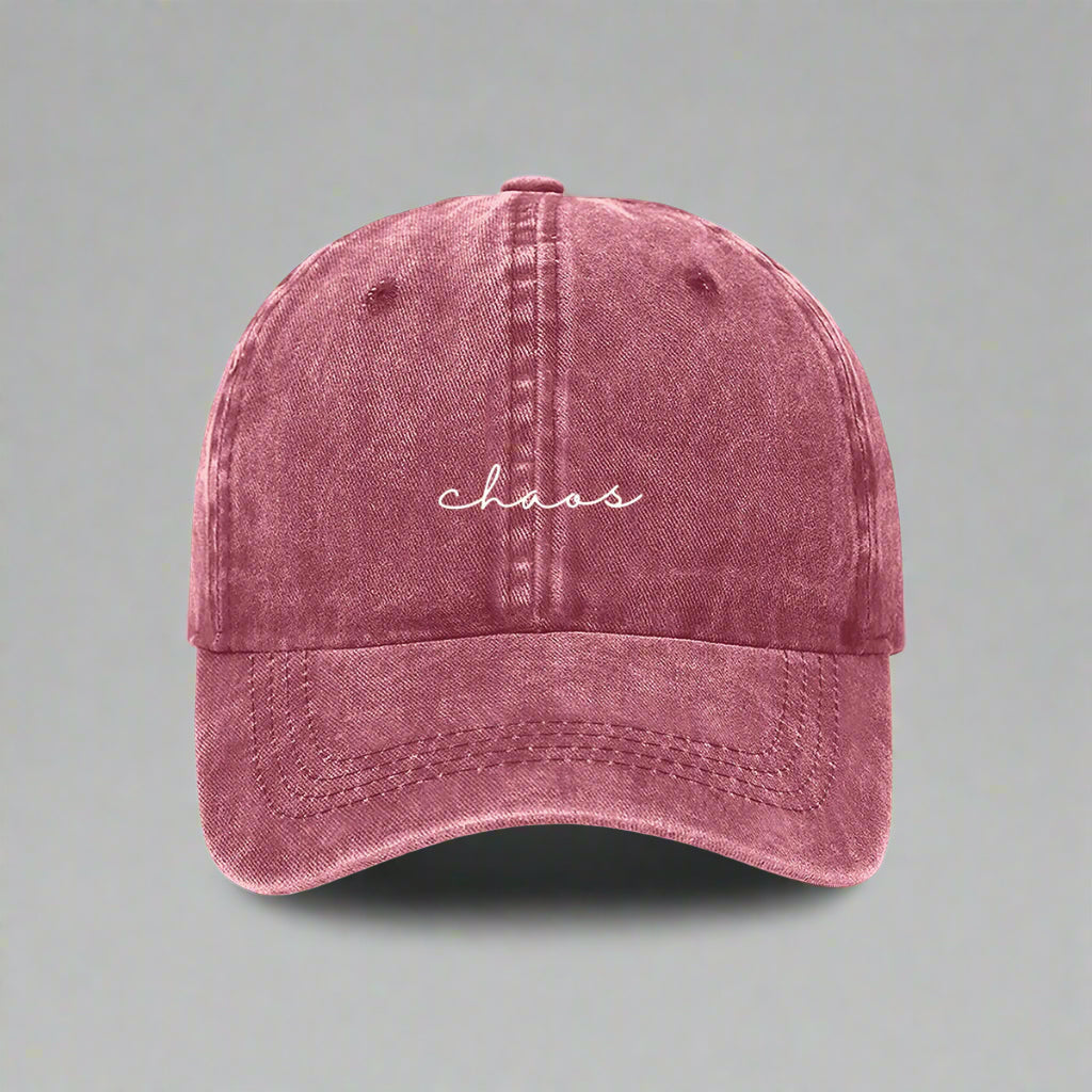Maroon cap with 'chaos' embroidered on a white background