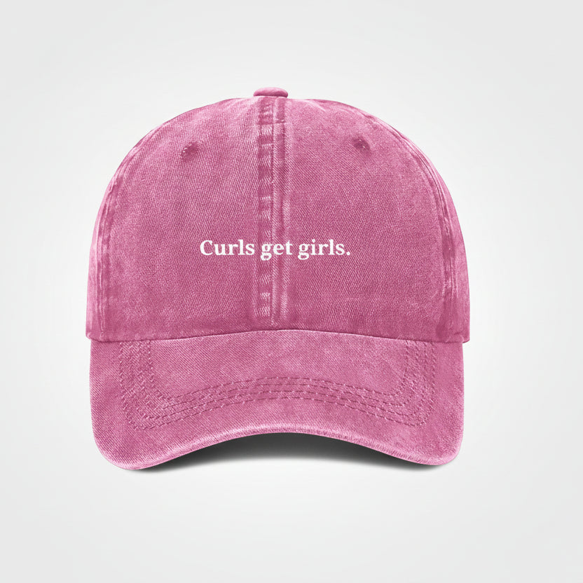 Pink embroidered cap that says curls get girls in white lettering. perfect for the gym