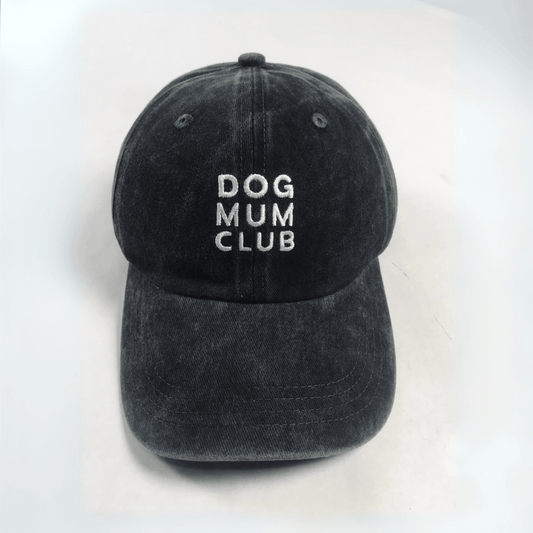 Black cap with 'DOG MUM CLUB' text on a white background