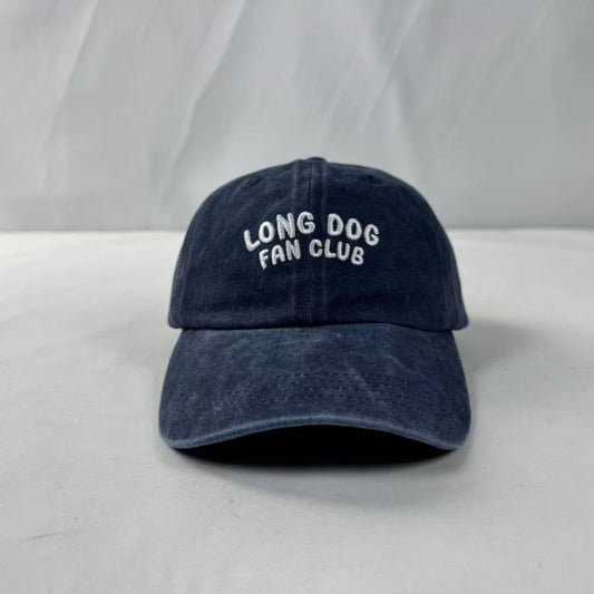 Navy blue cap with 'Long Dog Fan Club' text on a white background