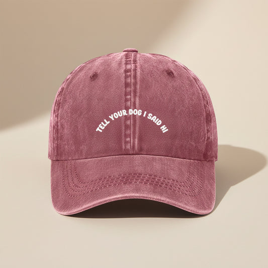 Maroon cap with text 'Tell your dog I said hi' on a white background