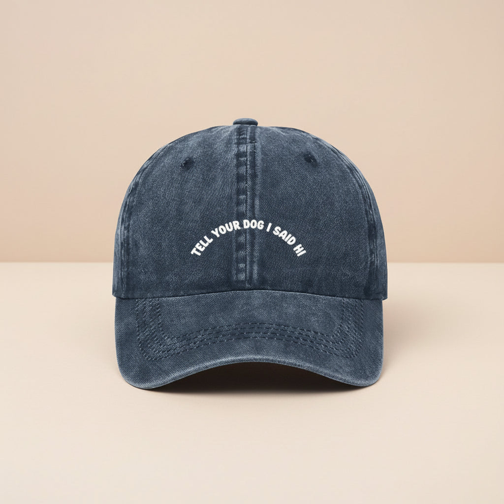 Navy blue cap with white text on a white background