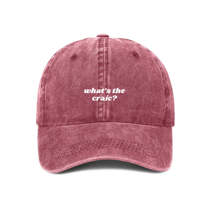 Maroon baseball cap with the word's 'what's the craic' embroidered on the front.