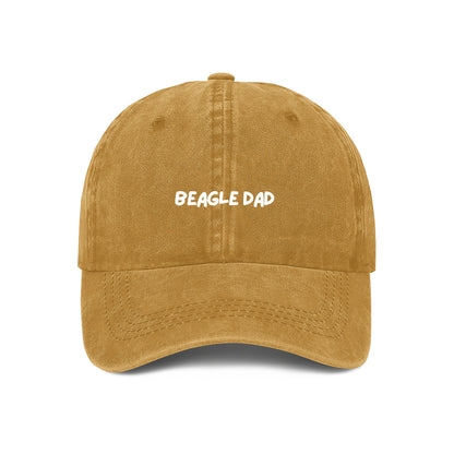 A yellow denim baseball cap with 'BEAGLE DAD' text embroidered on the front.
