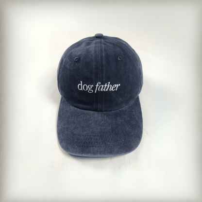 navy cap with white embroidered text that says "dog father