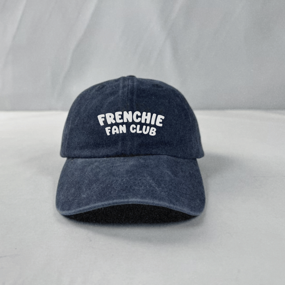Blue cap with 'FRENCHIE FAN CLUB' text on a light gray background