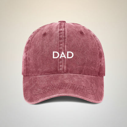 maroon cap with 'DAD' embroidered on a white background