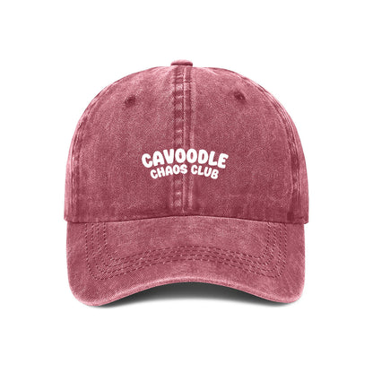 maroon cap with 'Cavoodle Chaos Club' text on a white background