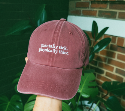 maroon cap that says mentally sick physically thicc