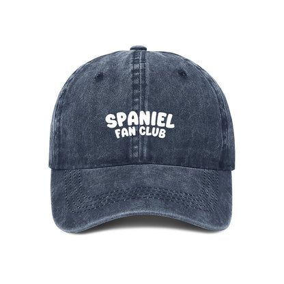 Navy blue cap with 'SPANIEL FAN CLUB' text on a white background