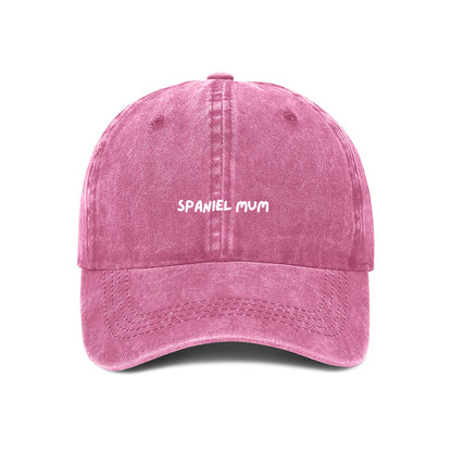 A Pink denim cotton cap with 'SPANIEL MUM' text embroidered on the front