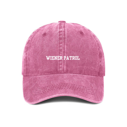 A pink embroidered baseball cap with 'WIENER PATROL' text in white on the front.