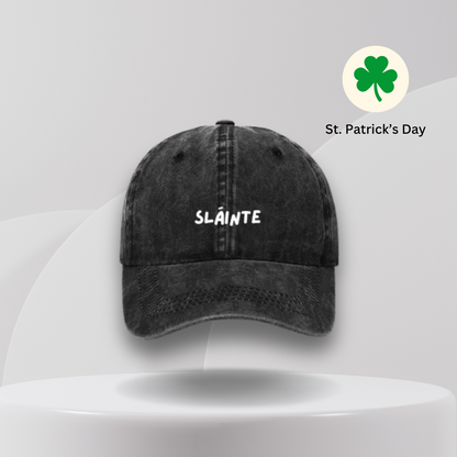 A gray baseball cap with the word 'Sláinte' embroidered on the front.