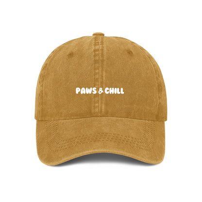 yellow cap with paws and chill embroidered on the front. Perfect gift idea for pet owners
